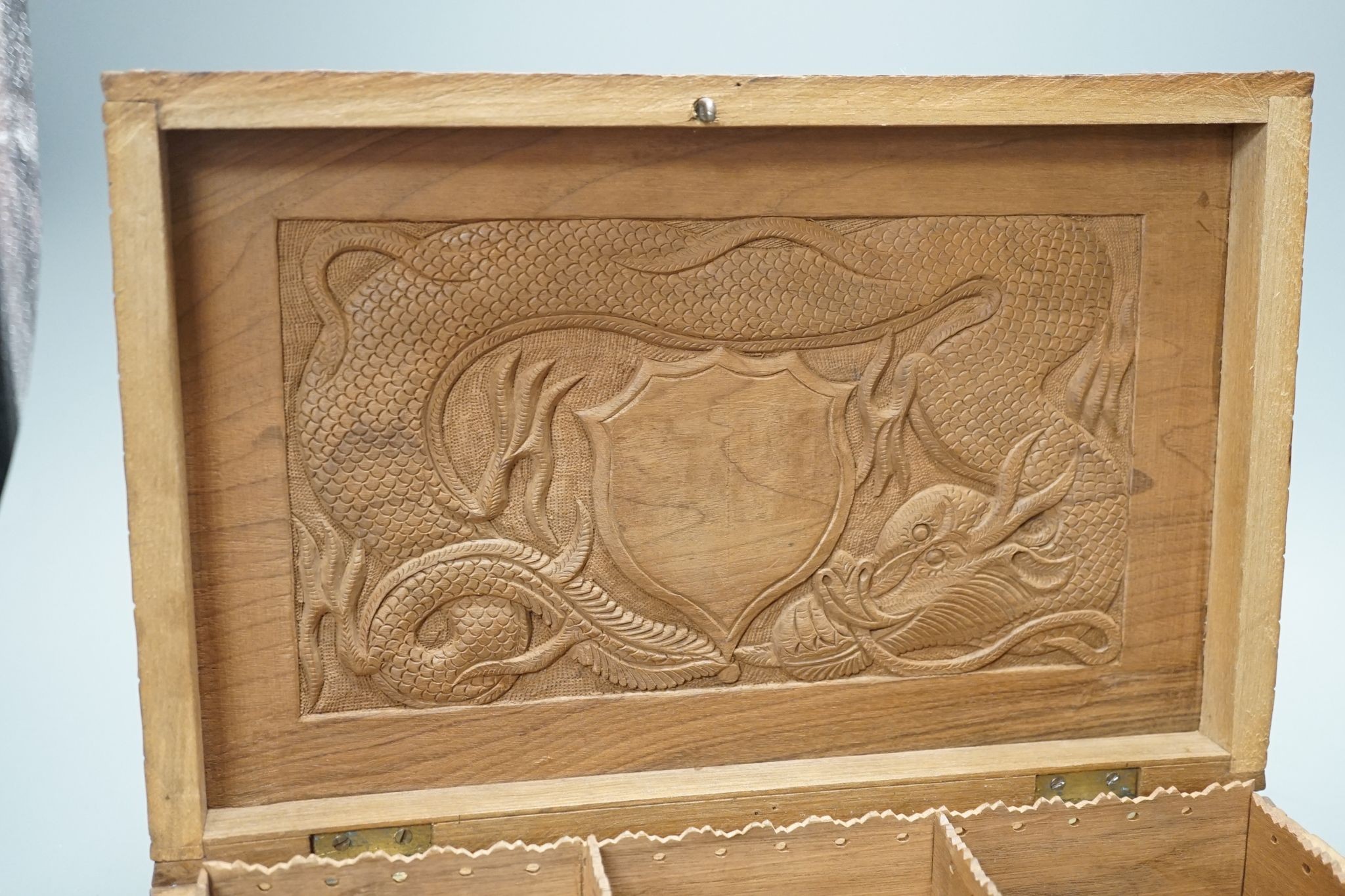 A Burmese carved wood 'Dragon' box, 31cm wide